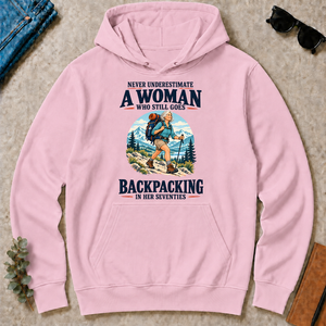 Never Underestimate A Woman Still Goes Backpacking - light-pink - HS2D-LightPink