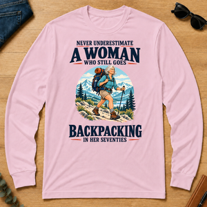 Never Underestimate A Woman Still Goes Backpacking - light-pink - LST2D-LightPink